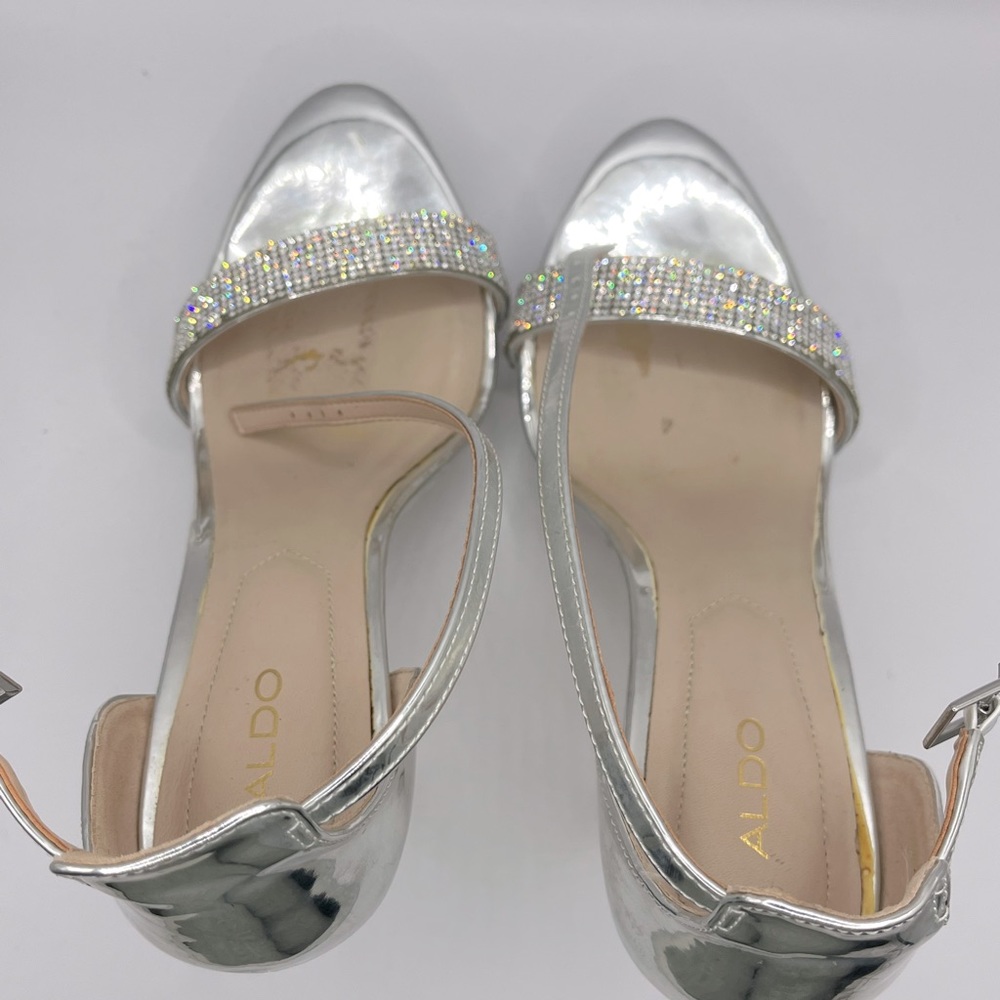 Aldo Silver Heels. Worn once, Good condition. Small scuff on right heel.